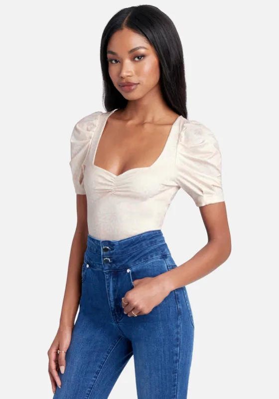 Shirred Front Neck Ruched Sleeve Printed Knit Top sold by Bebe