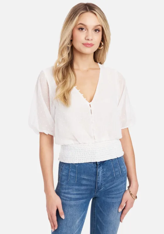 Swiss Dot Multi Button Smocked Hem Blouse sold by Bebe