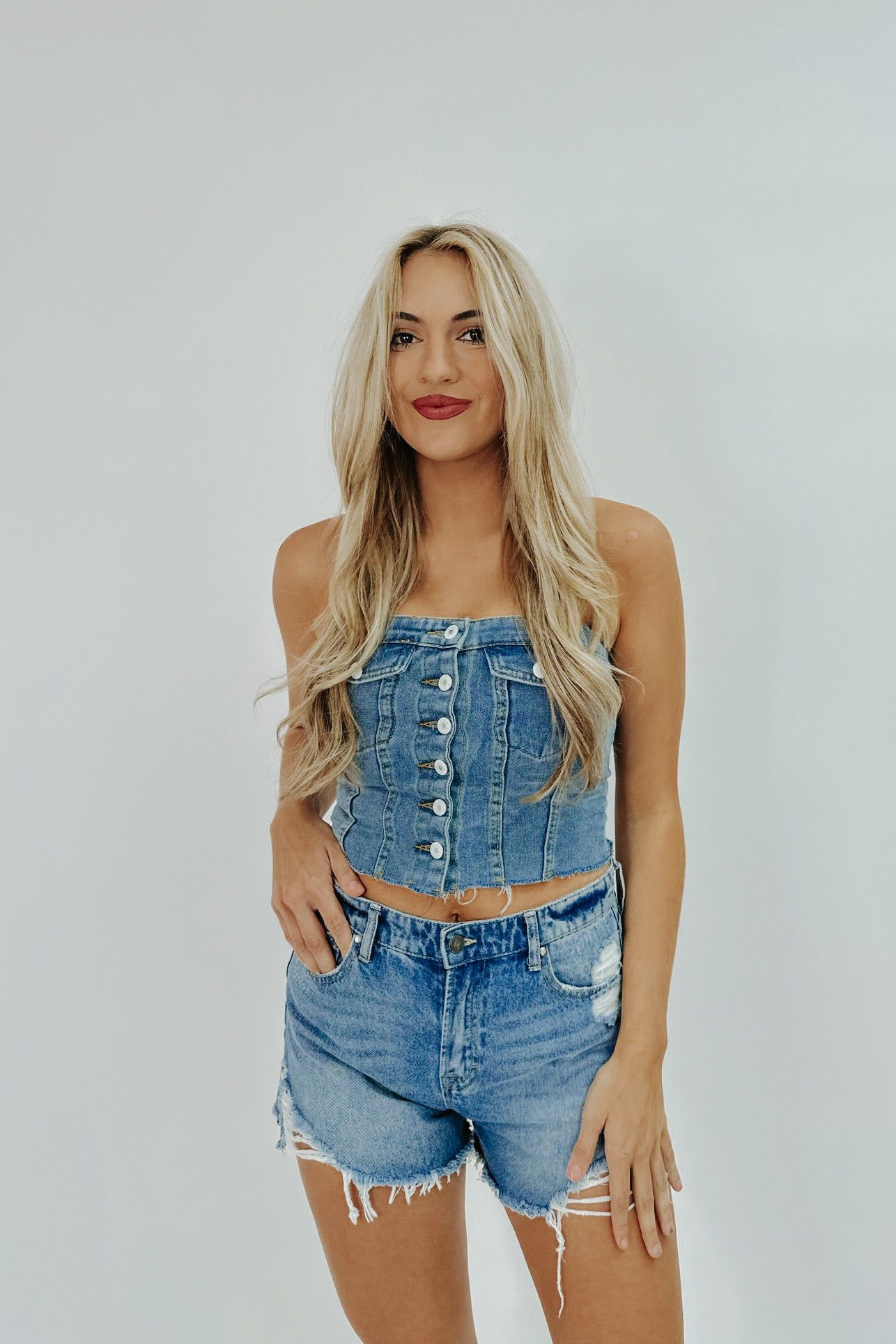 Mostly Sweet Denim Corset Top sold by Bella Rose boutique
