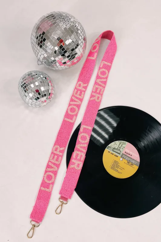 The "LOVER" Beaded Purse Strap sold by Bella Rose boutique