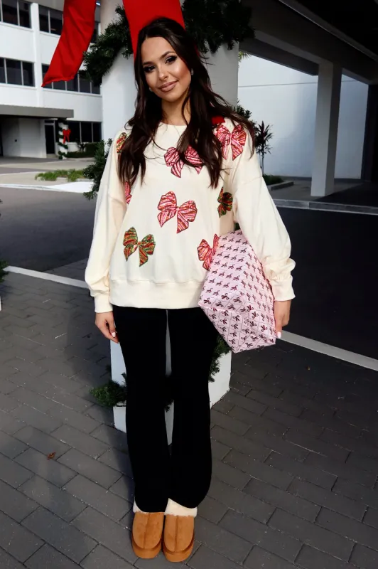 Wrapped In A Bow Oversized Sweatshirt sold by Bella Rose boutique