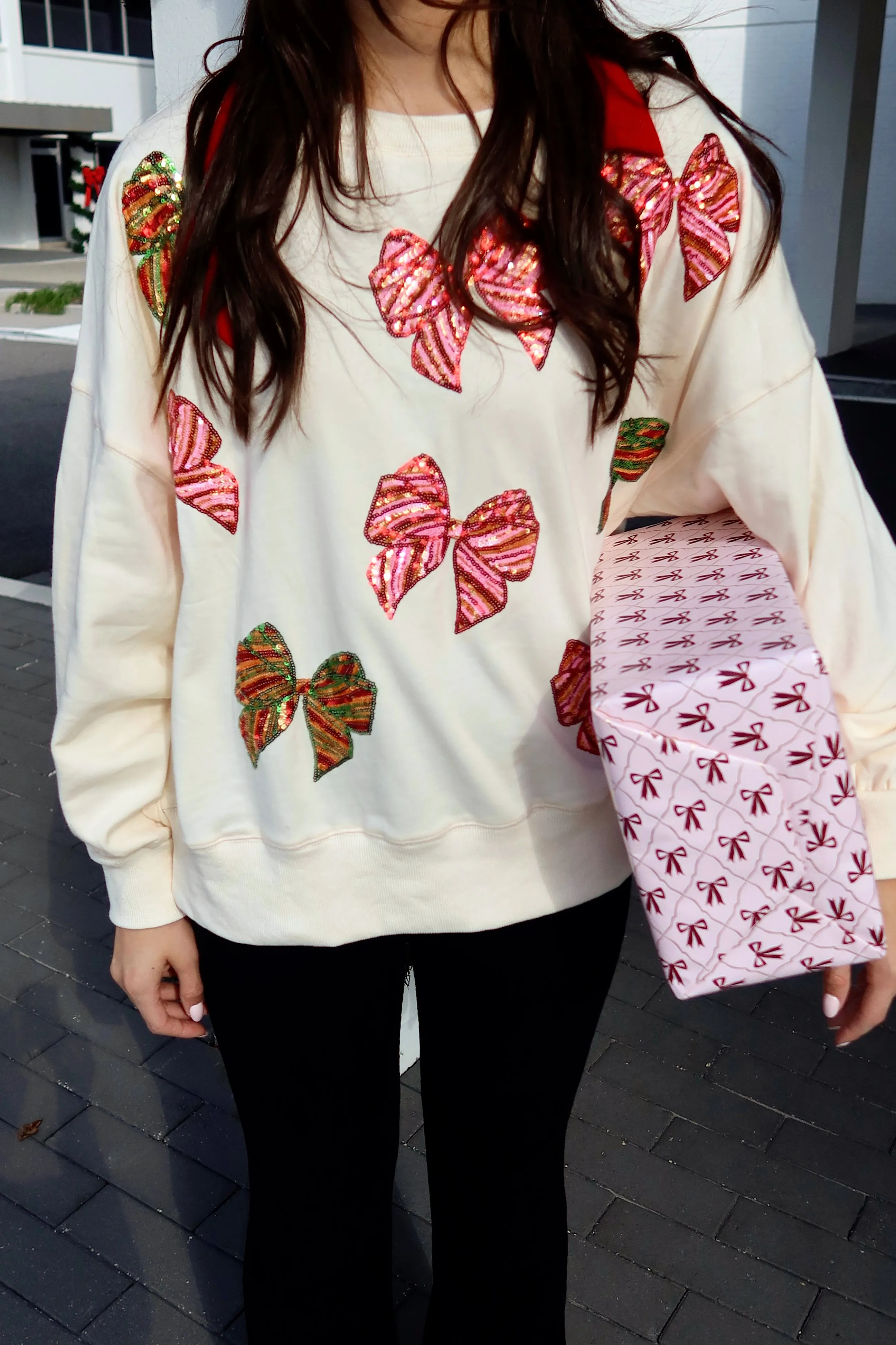 Wrapped In A Bow Oversized Sweatshirt sold by Bella Rose boutique product image thumbnail 2