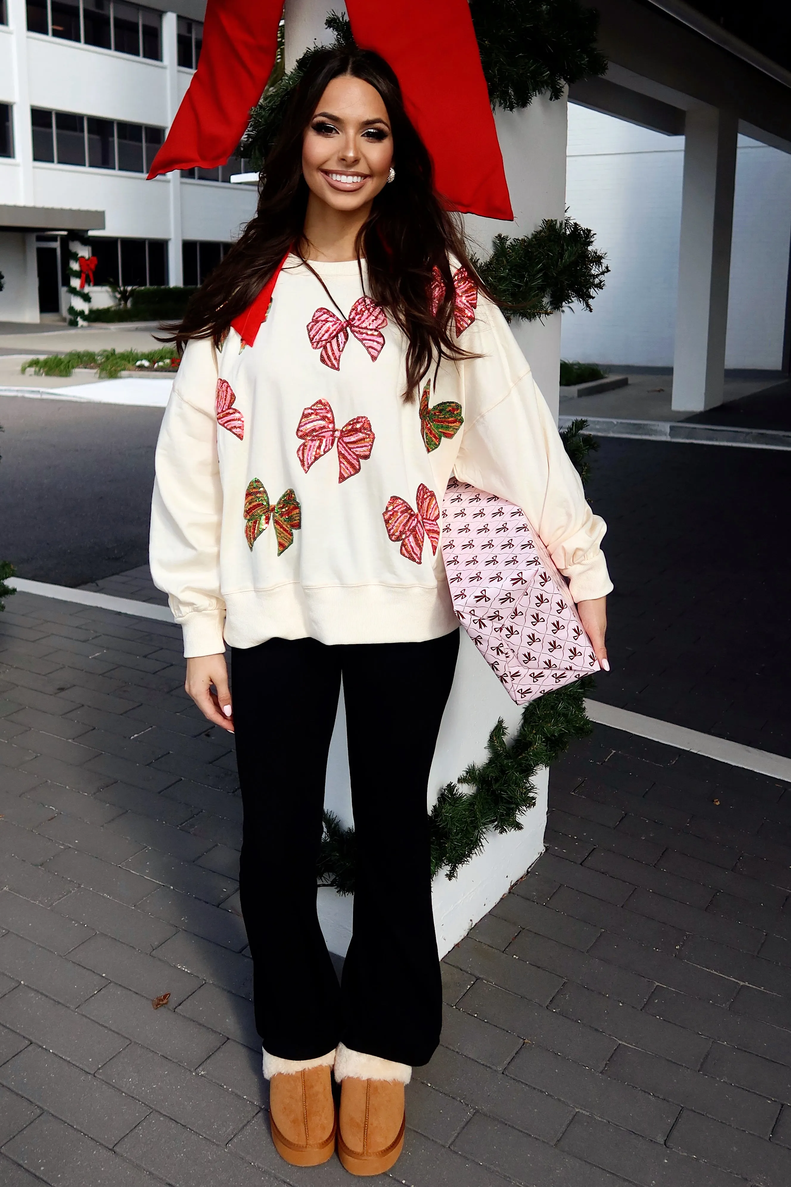 Wrapped In A Bow Oversized Sweatshirt sold by Bella Rose boutique product image thumbnail 4