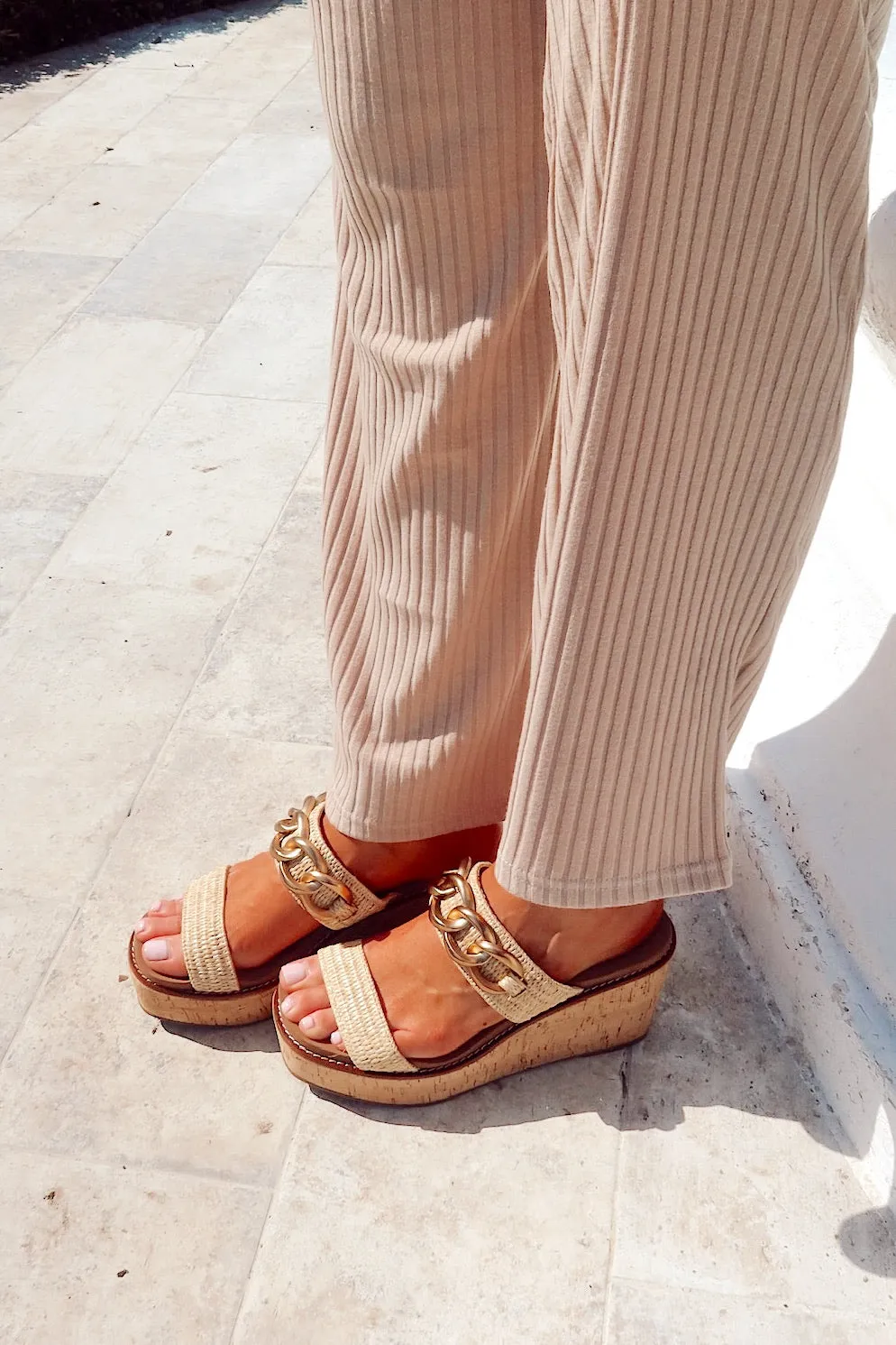 On Vacay Raffia Wedge sold by Bella Rose boutique