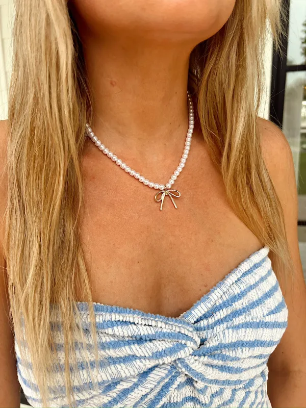 RESTOCK: Desired Perfection Gold Pearl Bow Charm Necklace sold by Bella Rose boutique