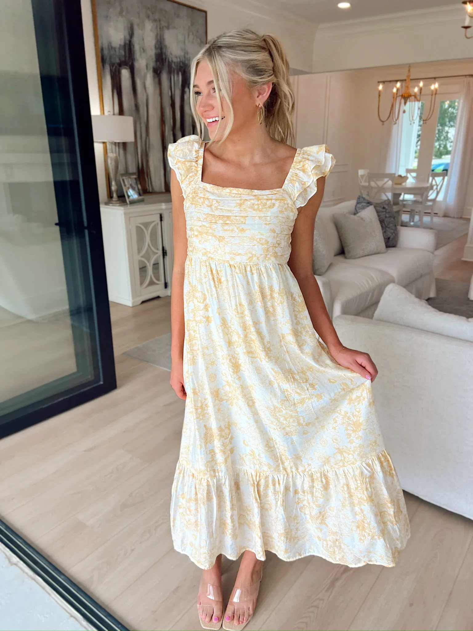 Field of Flowers Pleated Midi Dress sold by Bella Rose boutique