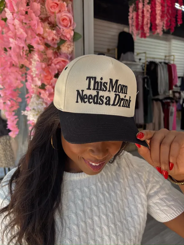This Mom Needs A Drink Trucker Hat sold by Bella Rose boutique