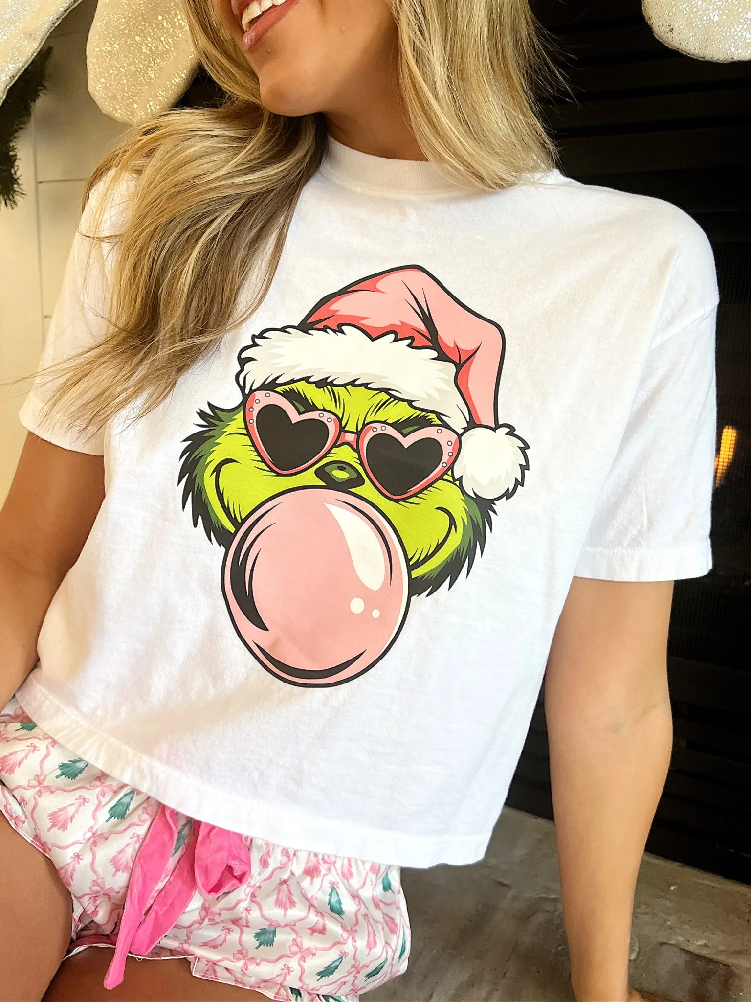 Bubblegum Grinch Graphic Top sold by Bella Rose boutique