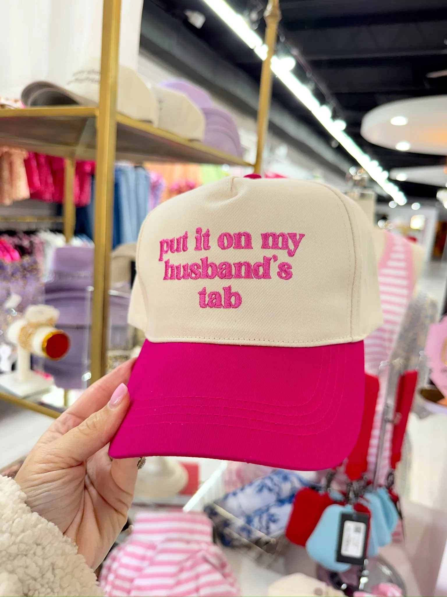 Put It On My Husband's Tab Trucker Hat sold by Bella Rose boutique