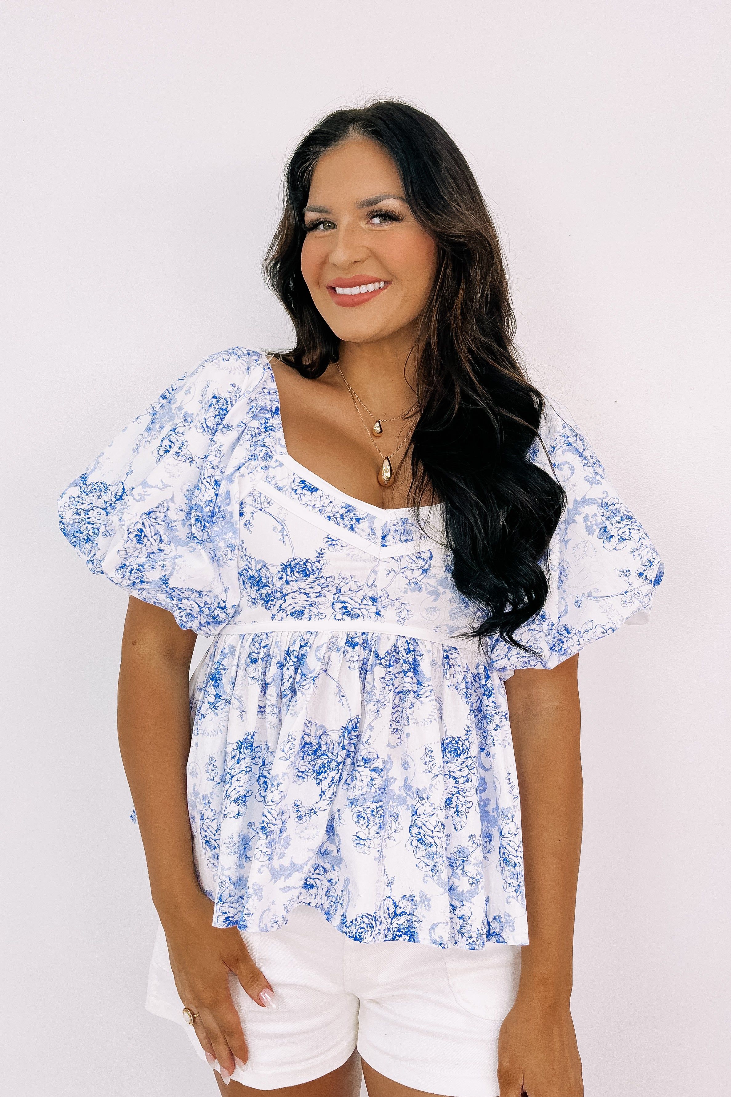Sweetly Surprised Floral Top sold by Bella Rose boutique