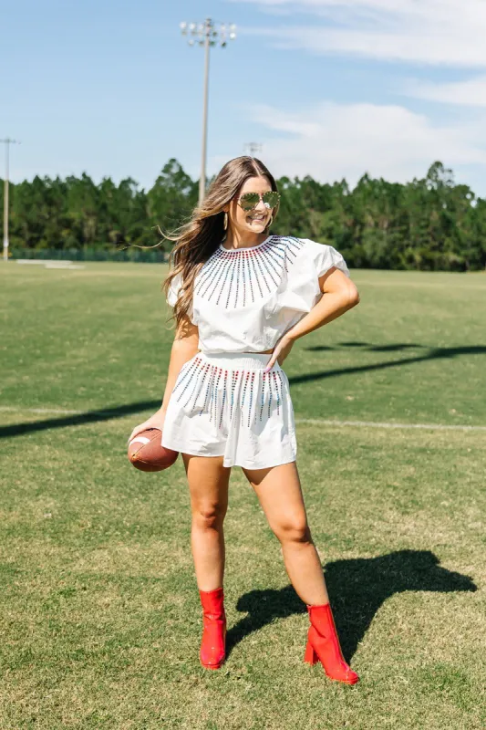 QUEEN OF SPARKLES: Touchdown Sparks Embellished Top sold by Bella Rose boutique