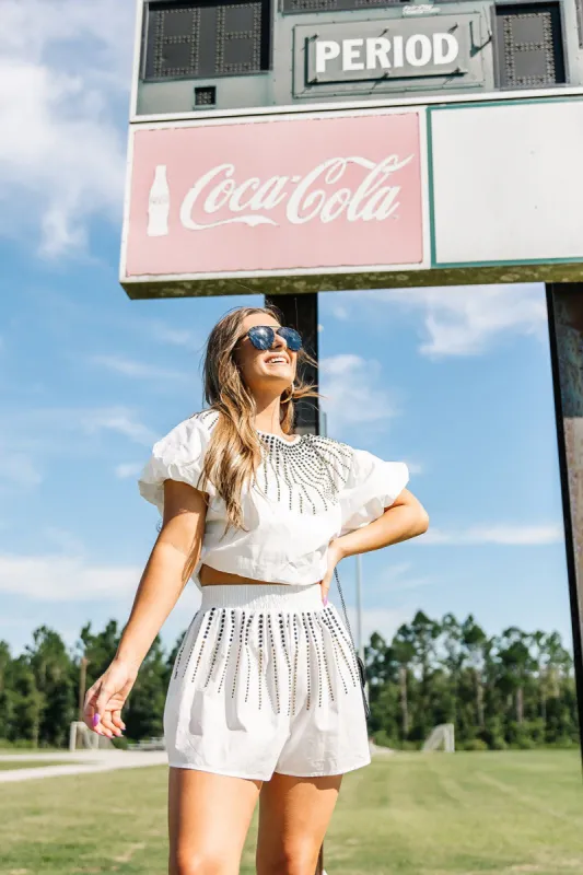 QUEEN OF SPARKLES: Touchdown Sparks Embellished Top sold by Bella Rose boutique