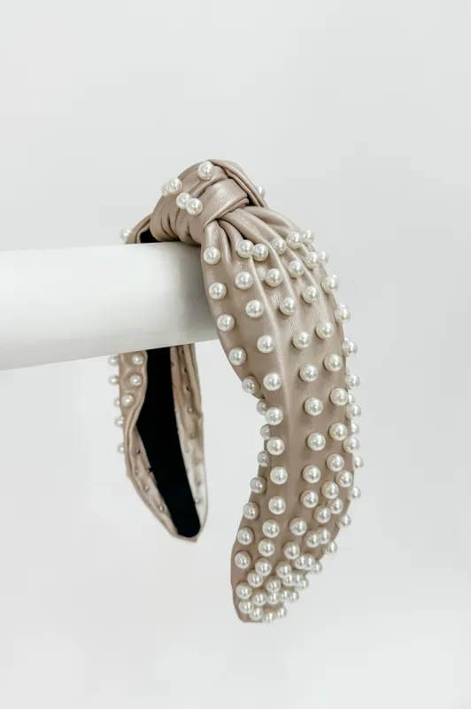 The "Thick Pearl" Knot Heatband sold by Bella Rose boutique