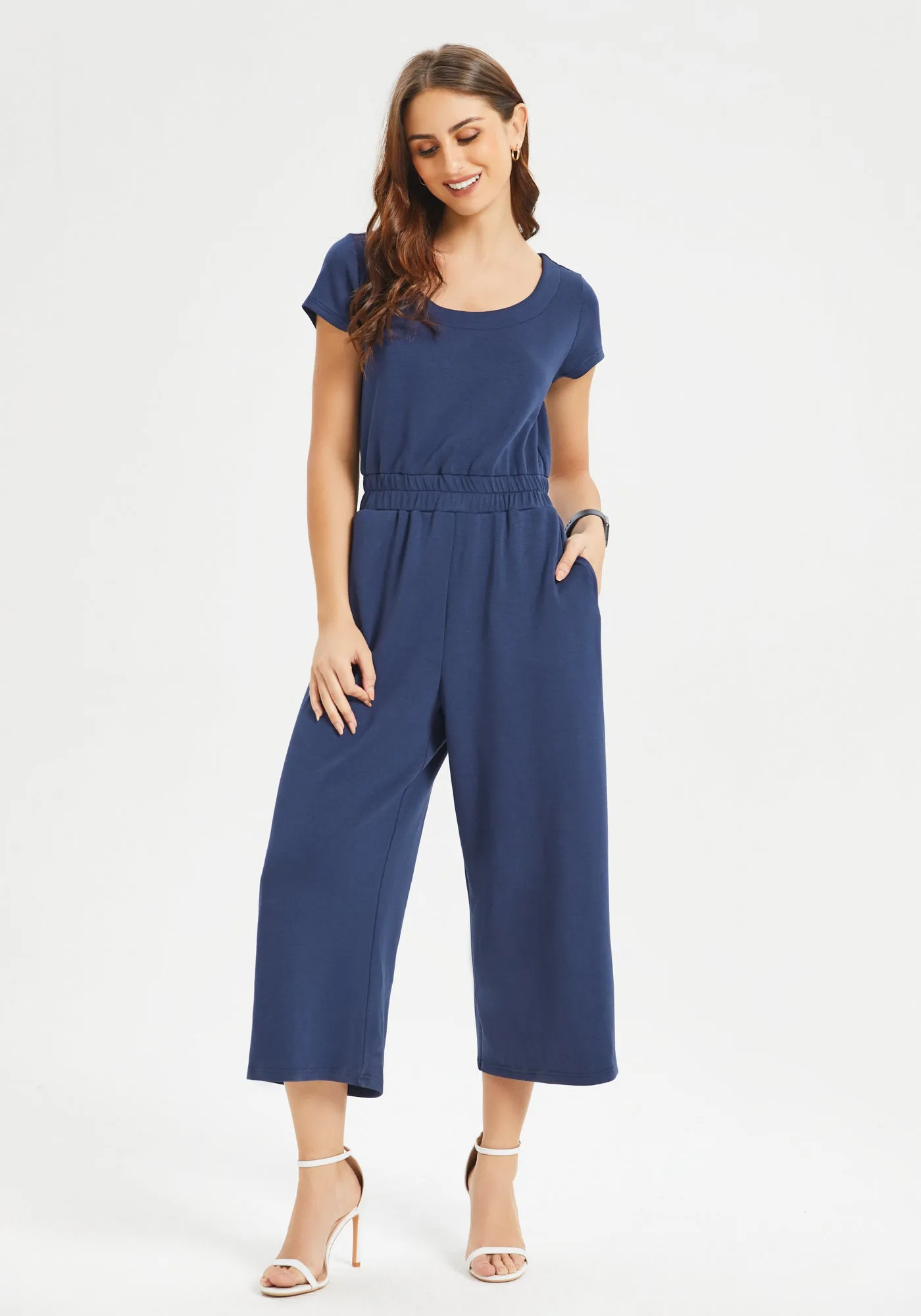 AirFlex Short Sleeve Jumpsuit (Navy) sold by Betabrand