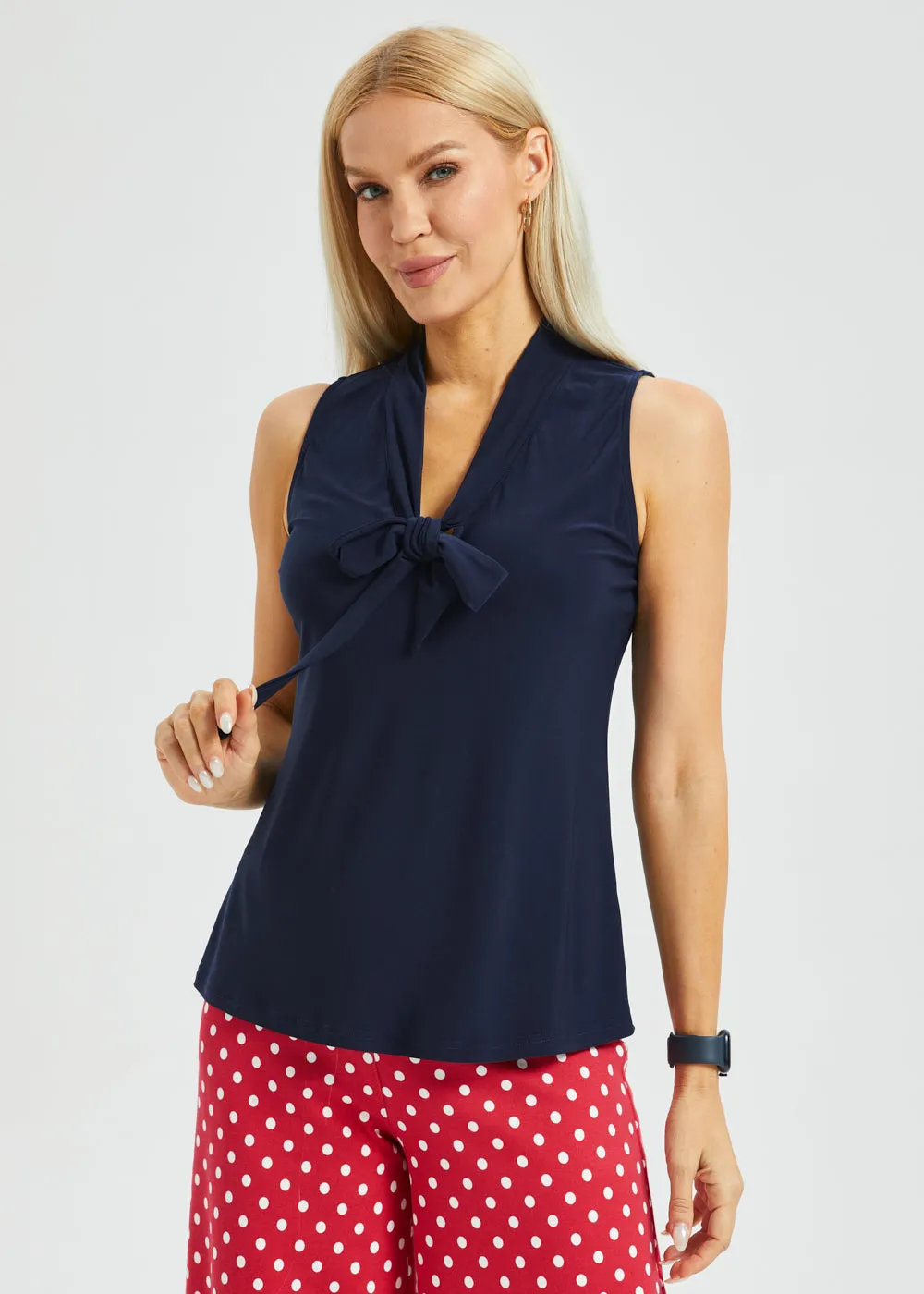 Sleeveless Bow Blouse (Navy) sold by Betabrand