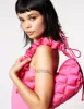 QUILTED NYLON SLING BAG PINK sold by Betsey Johnson