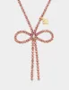 BOW PENDANT PINK sold by Betsey Johnson