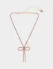 BOW PENDANT PINK sold by Betsey Johnson