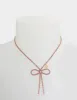 BOW PENDANT PINK sold by Betsey Johnson