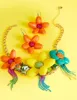 BETSEYS PUFFY FLOWER BIB NECKLACE MULTI sold by Betsey Johnson