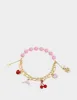 BETSEYS POOL PARTY DOLPHIN STRETCH BRACELET PINK sold by Betsey Johnson