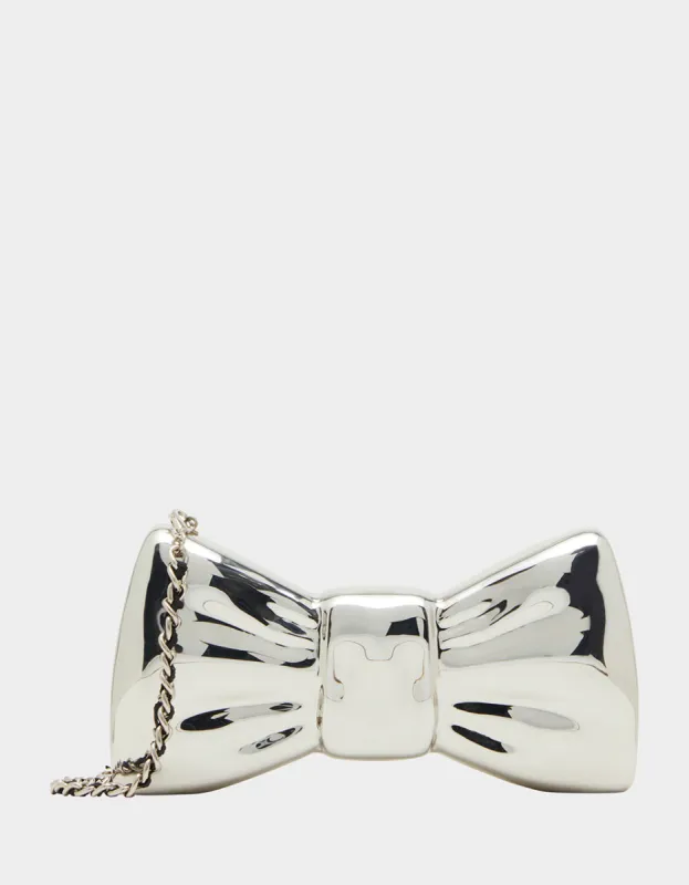 METAL BOW CLUTCH SILVER sold by Betsey Johnson