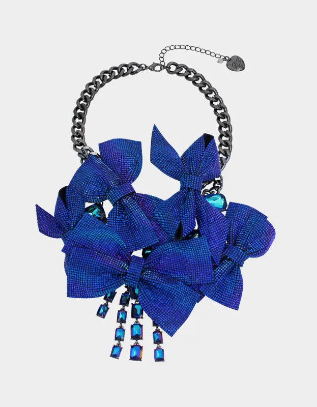 RECOLOR BOWS PAVE BOW BIB BLUE sold by Betsey Johnson