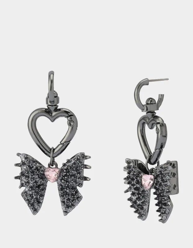 SPIKY BOW HUGGIE DROP EARRINGS PINK sold by Betsey Johnson