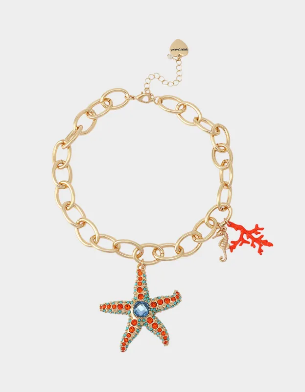 STARFISH SHORT PENDANT NECKLACE ORANGE made by Betsey Johnson