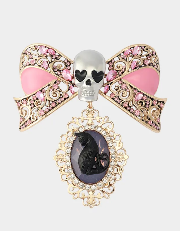 BOW SKULL BROOCH PINK made by Betsey Johnson