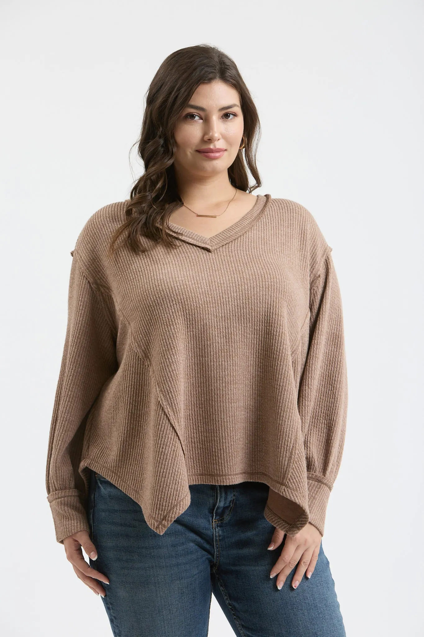 PLUS V NECK ASYMMETRICAL HEM LONG SLEEVE KNIT TOP sold by Blu Pepper