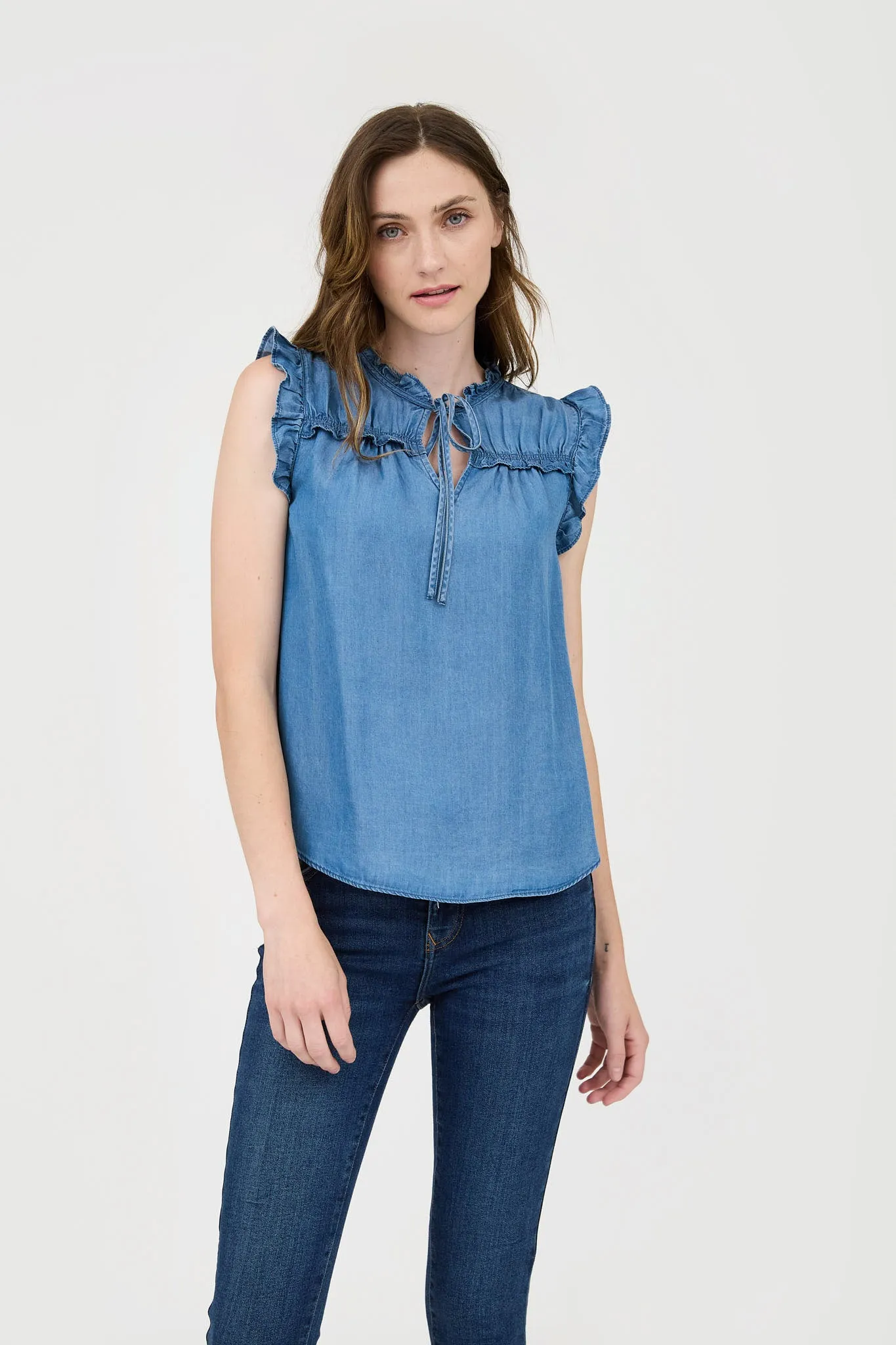 CHAMBRAY RUFFLE TIE FRONT SLEEVELESS BLOUSE sold by Blu Pepper