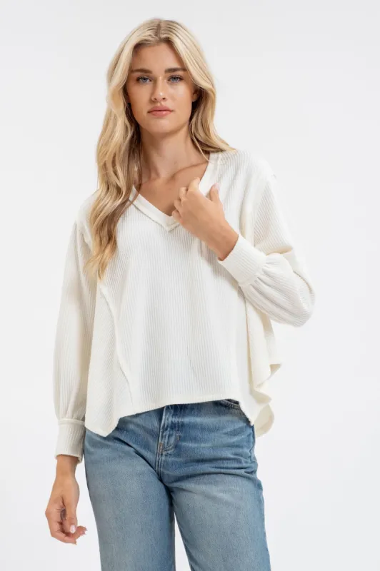 V NECK ASYMMETRICAL HEM LONG SLEEVE KNIT TOP sold by Blu Pepper