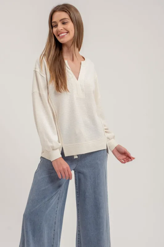 SPLIT NECK EXPOSED SEAM LONG SLEEVE KNIT TOP sold by Blu Pepper