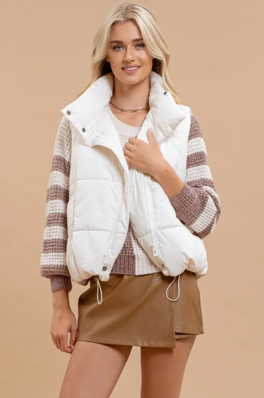 ASYMMETRICAL ZIP UP HIGH NECK PUFFER VEST sold by Blu Pepper
