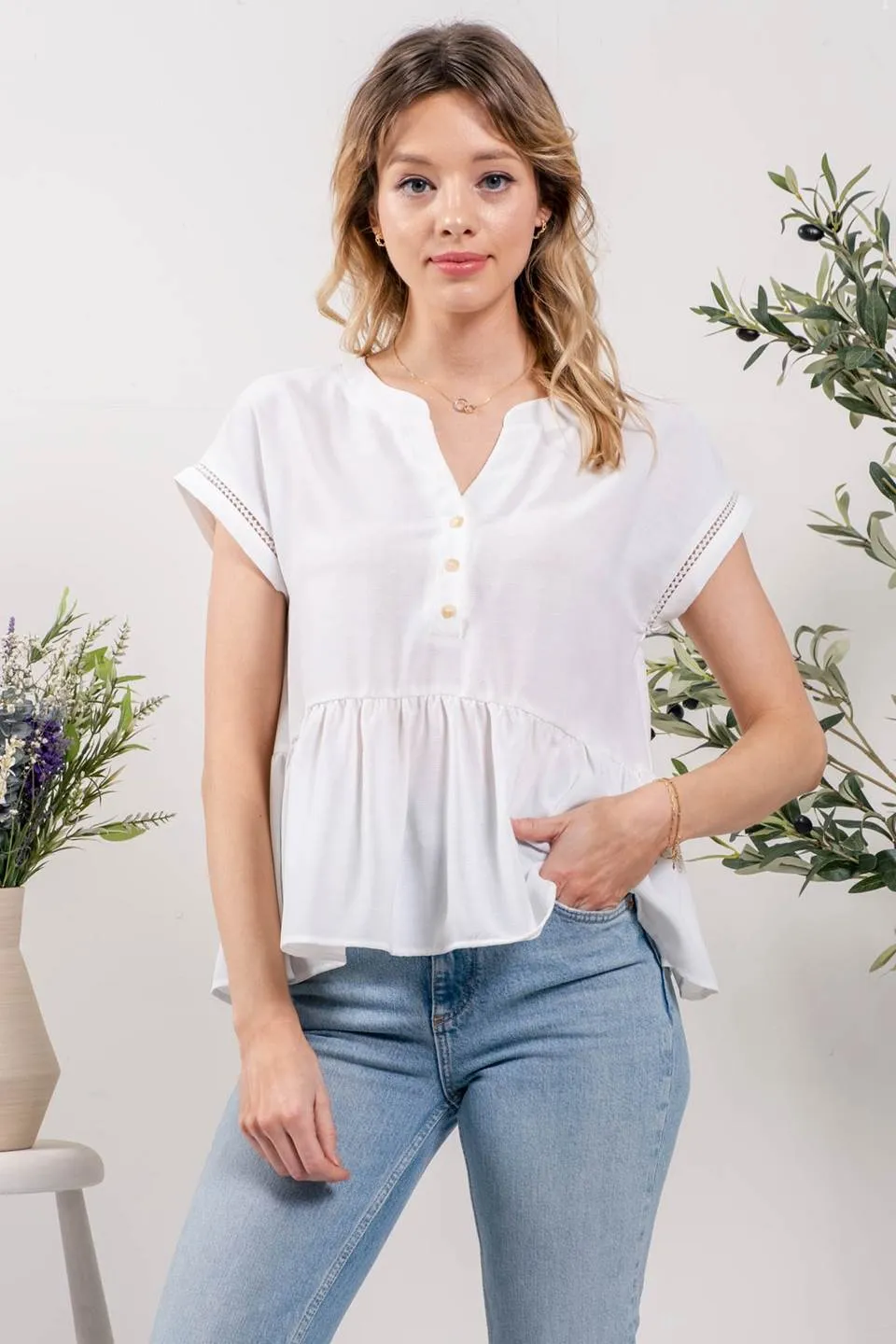 RUFFLE HEM SOLID WOVEN TOP sold by Blu Pepper