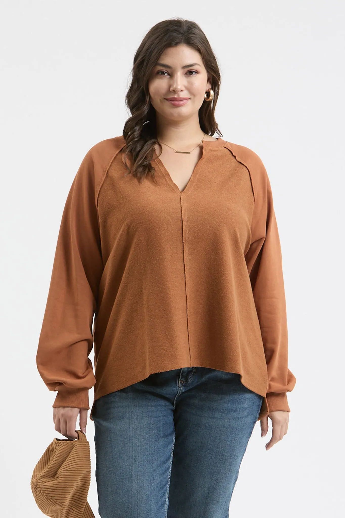 PLUS EXPOSED SEAM RELAXED LONG SLEEVE KNIT TOP sold by Blu Pepper