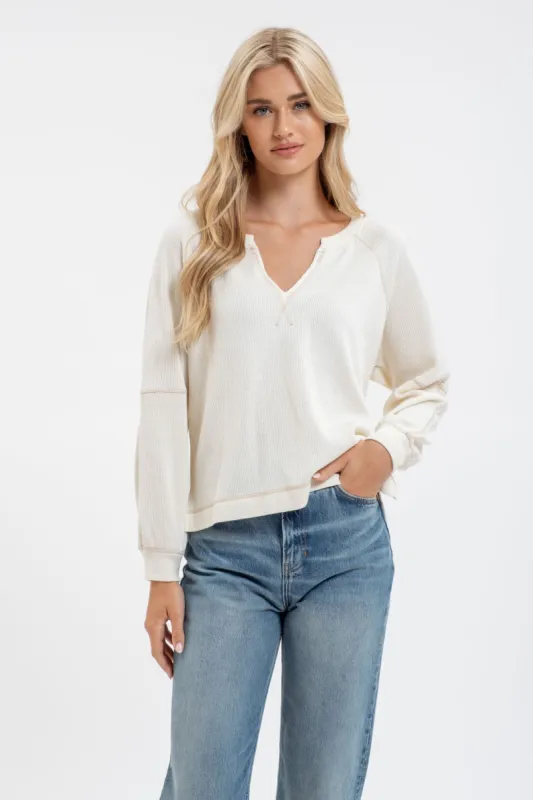 SPLIT NECK LONG EXTENDED SLEEVE RAGLAN KNIT TOP sold by Blu Pepper