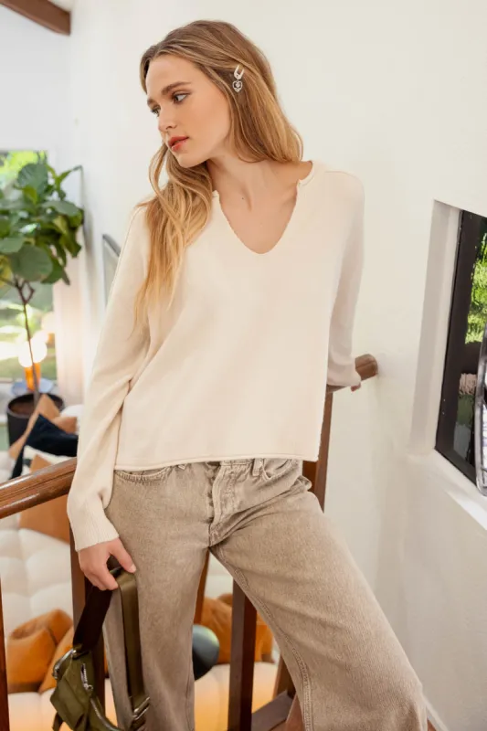 EXPOSED SEAM SPLIT NECK KNIT SWEATER sold by Blu Pepper