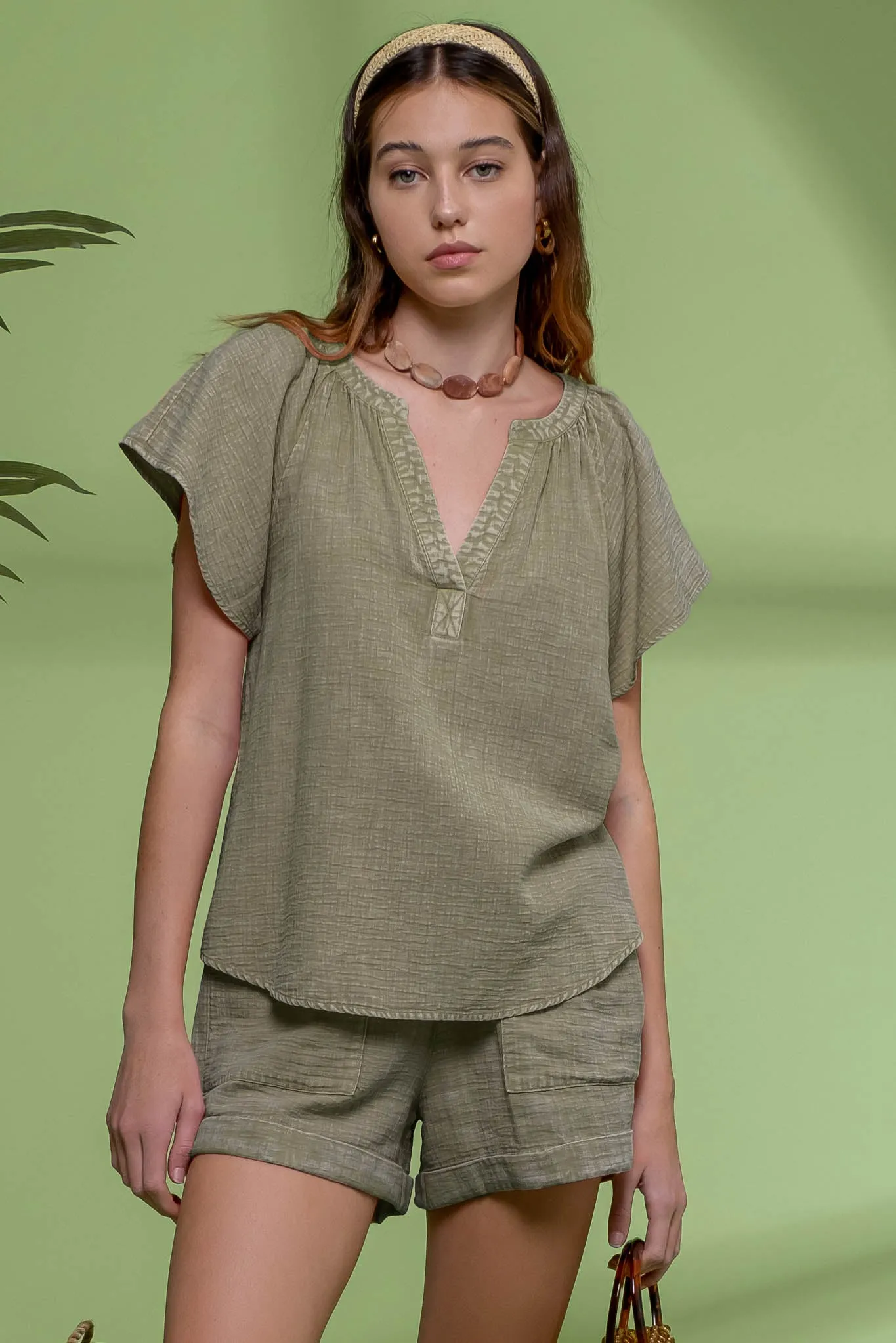 WASHED SPLIT NECK FLUTTER SLEEVE TOP sold by Blu Pepper