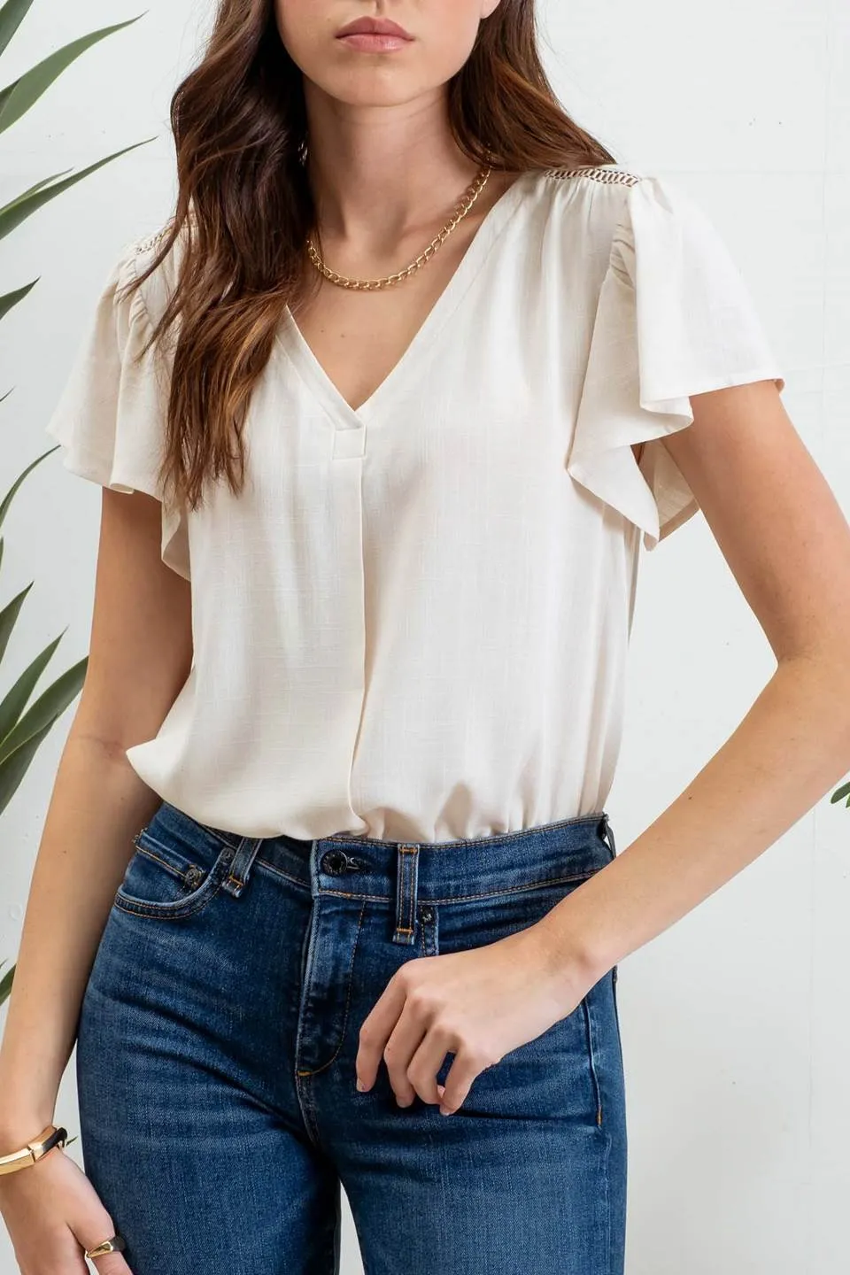 FOLDED V NECK SHORT RUFFLE SLEEVE TOP sold by Blu Pepper