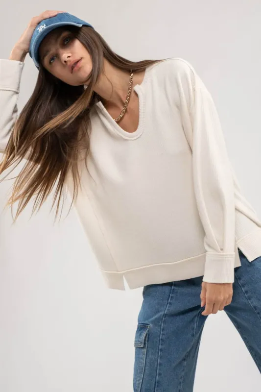 RAW EDGE SPLIT NECK AND HEM RIB KNIT TOP sold by Blu Pepper
