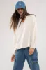 RAW EDGE SPLIT NECK AND HEM RIB KNIT TOP sold by Blu Pepper