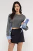CONTRAST SLEEVE CABLE KNIT SWEATER sold by Blu Pepper