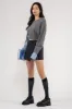 CONTRAST SLEEVE CABLE KNIT SWEATER sold by Blu Pepper