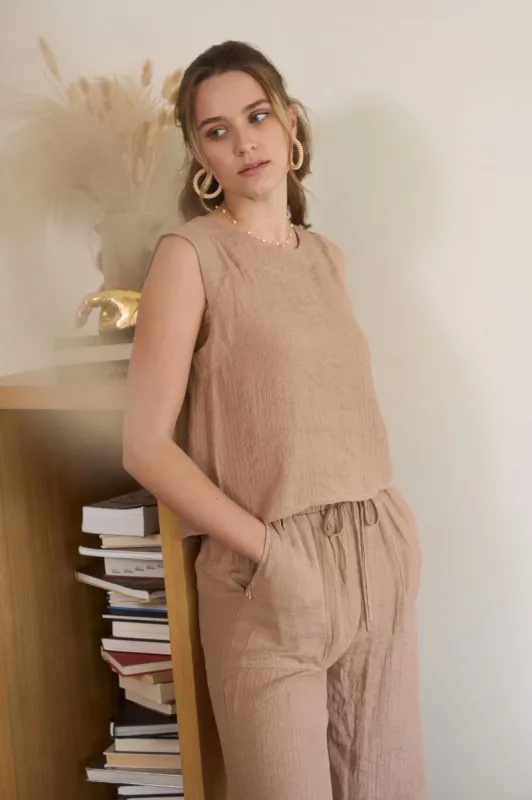 BACK BUTTON SPLIT HEM SLEEVELESS TOP sold by Blu Pepper