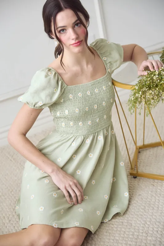 DAISY EMBROIDERY SMOCKED PUFF SLEEVE MINI DRESS sold by Blu Pepper