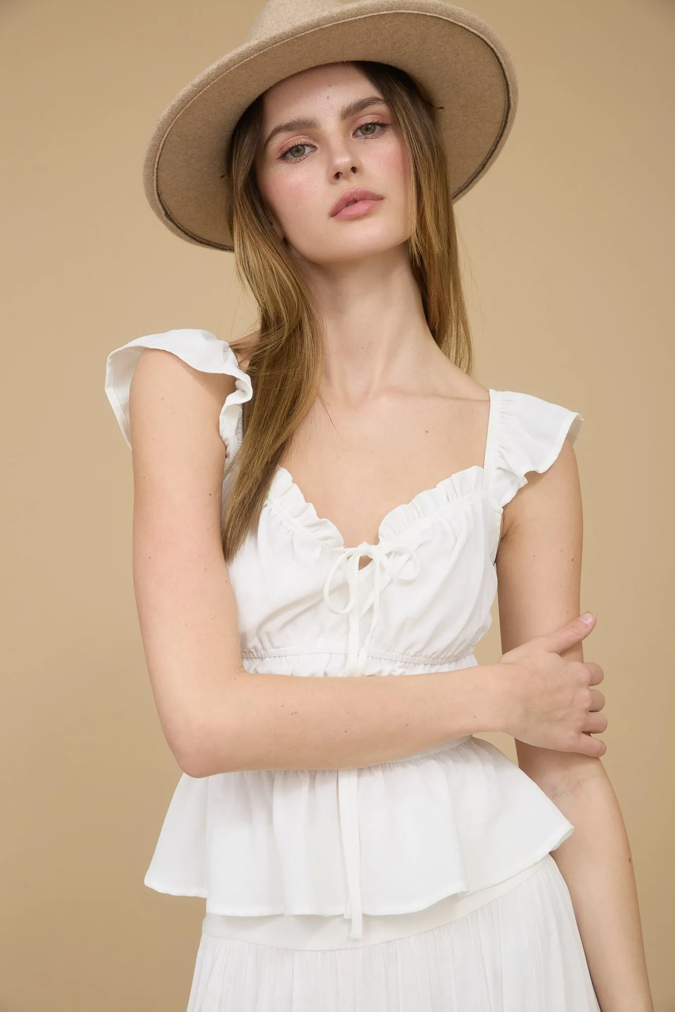 RUFFLE TRIM FRONT TIE SHIRRED WAIST BLOUSE sold by Blu Pepper