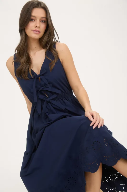 FRONT BOW TIE SLEEVELESS EYELET HEM MIDI DRESS sold by Blu Pepper