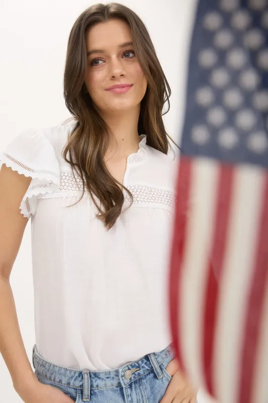 SPLIT NECK EYELET CROCHET TRIM RUFFLE DETAIL TOP sold by Blu Pepper